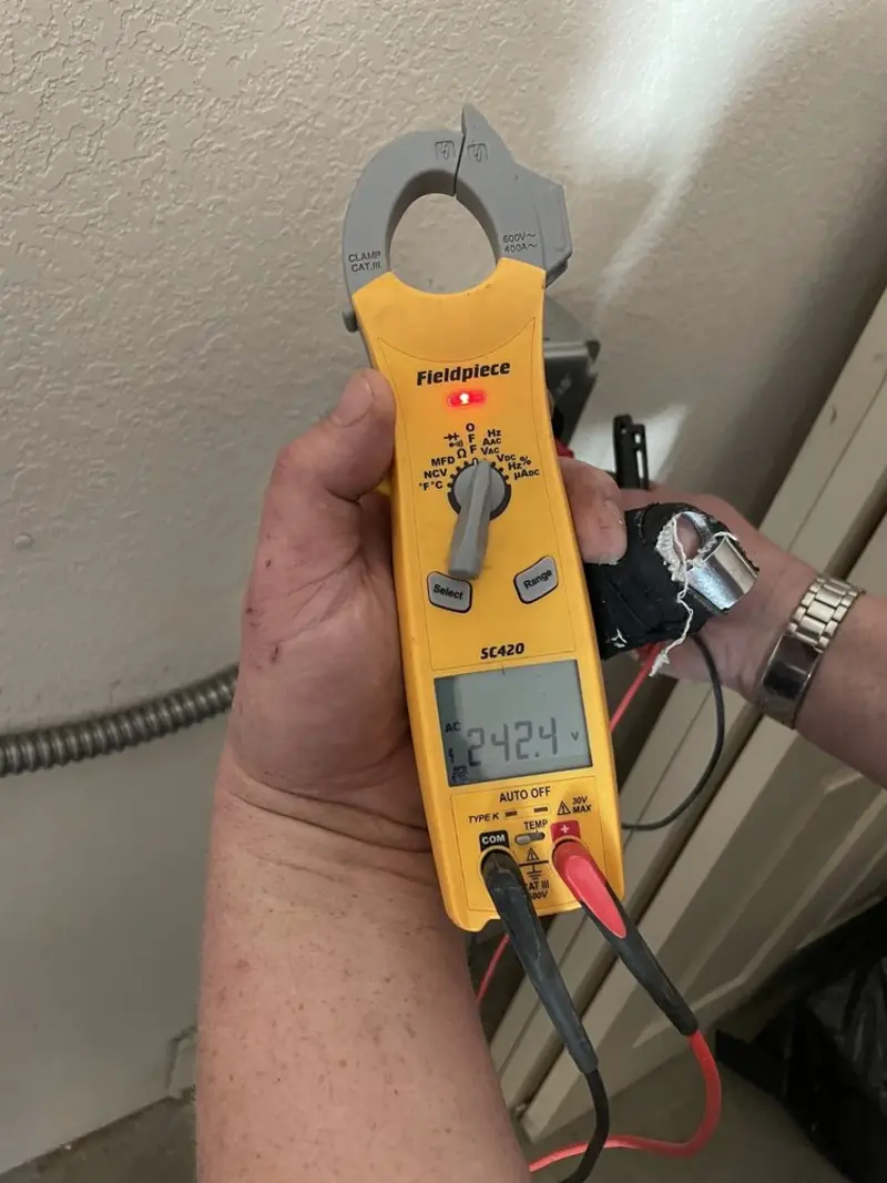Voltage testing with clamp meter during Electrical Installation Services in Jefferson City